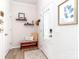 Bright foyer features modern decor, stylish bench seating with a decorative pillow, and a welcoming atmosphere at 4268 Coachwhip Ave, Lancaster, SC 29720