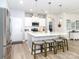 Modern kitchen with stainless appliances, white cabinets, island with seating, and pendant lights at 4268 Coachwhip Ave, Lancaster, SC 29720