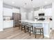 Modern kitchen with stainless appliances, white cabinets, island with seating, and pendant lights at 4268 Coachwhip Ave, Lancaster, SC 29720