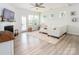 Living room with fireplace, white couch, lots of natural light and view to outdoor space at 4268 Coachwhip Ave, Lancaster, SC 29720
