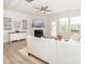 Bright living room featuring a fireplace, ceiling fan, and large windows for ample natural light at 4268 Coachwhip Ave, Lancaster, SC 29720