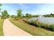 Scenic pond with fountain, walking path, and lush landscaping in a tranquil community setting at 4268 Coachwhip Ave, Lancaster, SC 29720