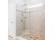 Modern walk-in shower with stone tile, glass enclosure, and multiple shower heads and sprayers at 4268 Coachwhip Ave, Lancaster, SC 29720