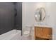 Modern bathroom with stylish fixtures, a bathtub, and sleek vanity at 4900 Doris Ave, Charlotte, NC 28205