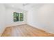 Sun-filled bedroom with hardwood floors, a ceiling fan, and natural light at 4900 Doris Ave, Charlotte, NC 28205