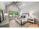 Bright bedroom with a vaulted ceiling, neutral walls, and ample natural light from the large windows at 4900 Doris Ave, Charlotte, NC 28205