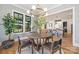 Modern dining room with stylish light fixture adjacent to the kitchen and living areas at 4900 Doris Ave, Charlotte, NC 28205