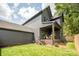 Charming home exterior with a covered patio and beautifully landscaped yard at 4900 Doris Ave, Charlotte, NC 28205