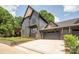 Modern two-story home featuring attached garage and landscaped front yard at 4900 Doris Ave, Charlotte, NC 28205