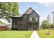 Stunning two-story home with a combination of modern siding and brick accents at 4900 Doris Ave, Charlotte, NC 28205