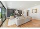 Elegant living room with fireplace, stylish decor, and access to the outdoor space through large glass doors at 4900 Doris Ave, Charlotte, NC 28205