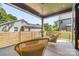Covered patio with stylish wicker furniture, perfect for outdoor relaxation at 4900 Doris Ave, Charlotte, NC 28205