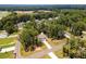 Aerial view of a neighborhood home surrounded by mature trees on a sunny day at 5499 Angus Dr, Midland, NC 28107