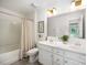 Bright bathroom featuring a double vanity with modern fixtures and a shower-tub combination at 5499 Angus Dr, Midland, NC 28107