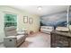 Adorable Bedroom with a crib, accent wall, glider chair, and whimsical decor at 5499 Angus Dr, Midland, NC 28107