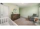 Cozy Bedroom features a rocking chair, dresser with changing pad, and stylish decor at 5499 Angus Dr, Midland, NC 28107