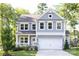 Charming two-story home with a covered porch, attached garage, and well-maintained landscaping at 5499 Angus Dr, Midland, NC 28107