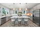 Bright kitchen with a large island, stainless appliances, and modern pendant lighting at 5499 Angus Dr, Midland, NC 28107