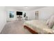 Large bedroom with soft carpet, a seating area, a large TV, and access to the en-suite bathroom at 5499 Angus Dr, Midland, NC 28107