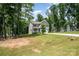 Charming home with green lawn and landscaping with mature trees at 5499 Angus Dr, Stanfield, NC 28163