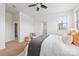 A bright bedroom features a ceiling fan, neutral decor and a glimpse of a closet at 558 Oakland Ave, Charlotte, NC 28204