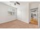 A bedroom with double closets features neutral decor and a window with natural light at 558 Oakland Ave, Charlotte, NC 28204