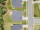 Aerial view of neighborhood showcasing manicured lawns, mature trees, and close proximity to shopping and amenities at 7739 Village Pkwy, Locust, NC 28097