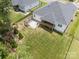 Aerial view of backyard with patio, fenced yard, and covered deck perfect for entertaining and enjoying the outdoors at 7739 Village Pkwy, Locust, NC 28097