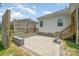 Backyard patio with a built-in grill, privacy fence, and ample space for outdoor gatherings and relaxation at 7739 Village Pkwy, Locust, NC 28097