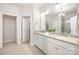 Elegant primary bathroom features double sinks, granite countertops, a glass-enclosed shower, and tile flooring at 7739 Village Pkwy, Locust, NC 28097
