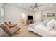 Serene primary bedroom featuring a ceiling fan, neutral tones, and an adjacent bathroom at 7739 Village Pkwy, Locust, NC 28097