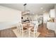 Dining room with hardwood floors flowing seamlessly to the living and kitchen area at 7739 Village Pkwy, Locust, NC 28097