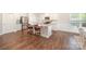 Bright kitchen boasts white cabinets, stainless steel appliances, granite countertops and island with seating at 7739 Village Pkwy, Locust, NC 28097