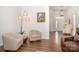 Cozy living area showcasing hardwood floors, neutral walls, and stylish modern furnishings at 7739 Village Pkwy, Locust, NC 28097