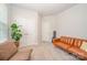 Bright living room with large windows, neutral walls, and comfortable seating, creating a welcoming and airy atmosphere at 7739 Village Pkwy, Locust, NC 28097