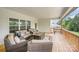 Inviting covered patio with comfortable seating, perfect for outdoor gatherings and enjoying the surrounding greenery at 7739 Village Pkwy, Locust, NC 28097