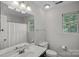 Neutral bathroom with a large mirror, vanity, toilet, and shower/tub combo at 807 Water Wheel Ct, Charlotte, NC 28209