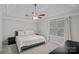 Bedroom featuring neutral walls, tray ceiling, window and soft carpet at 807 Water Wheel Ct, Charlotte, NC 28209