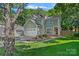 Charming two-story home with a well-manicured lawn and attached two-car garage at 807 Water Wheel Ct, Charlotte, NC 28209