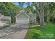 Charming two-story home with a well-manicured lawn and attached two-car garage at 807 Water Wheel Ct, Charlotte, NC 28209