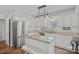 Bright kitchen featuring white cabinets, granite countertops, and stainless steel appliances at 807 Water Wheel Ct, Charlotte, NC 28209