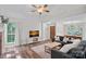 Spacious living room featuring hardwood floors, natural light, and fireplace at 807 Water Wheel Ct, Charlotte, NC 28209
