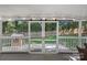 Enclosed porch with sliding barn doors leads to patio at 807 Water Wheel Ct, Charlotte, NC 28209