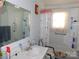 Bathroom featuring a single vanity sink and accessible bathtub and grab bars at 814 Aileen Cir, Pineville, NC 28134