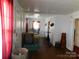 Living room showing chandelier and natural light from the large windows at 814 Aileen Cir, Pineville, NC 28134