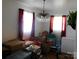 Living room showing chandelier and natural light from the large windows at 814 Aileen Cir, Pineville, NC 28134