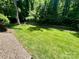 Beautifully manicured backyard featuring lush green grass and a charming fence at 841 16Th Avenue Nw Ln, Hickory, NC 28601
