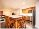 Basement bar area featuring a kitchen, island with seating, and an open floor plan at 841 16Th Avenue Nw Ln, Hickory, NC 28601