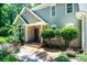 Charming home exterior with stone walkway, lush landscaping, and inviting front door at 841 16Th Avenue Nw Ln, Hickory, NC 28601