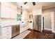 Charming kitchen with subway tile backsplash, stainless steel appliances, and hardwood floors at 841 16Th Avenue Nw Ln, Hickory, NC 28601